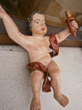 Pair of small carved and painted antique cherubs