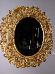 Reproduction hand-carved and gilt oval "Medici" mirror with beveled glass