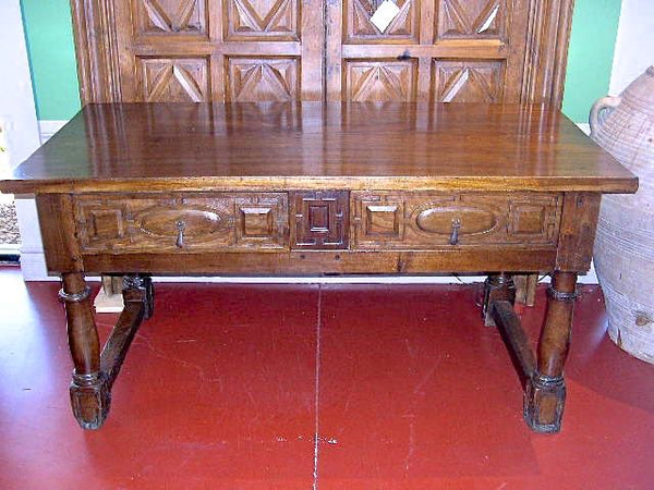 Antique carved two-drawer Castilian library table, walnut and cedar