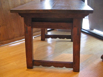Carved two-drawer Renaissance-style table