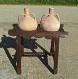 Two-hole pine water jug stand with original clay jugs