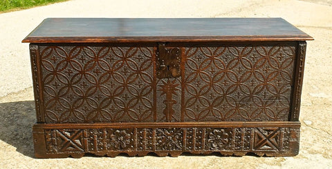 Antique carved French Basque dowry chest with fleur de lis design, chestnut