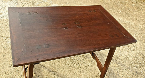 Trestle-leg campaign table with iron stretchers in walnut