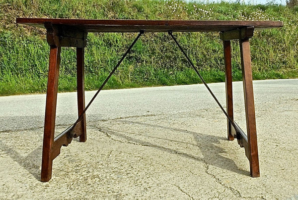Antique trestle-leg campaign table with iron stretchers, walnut