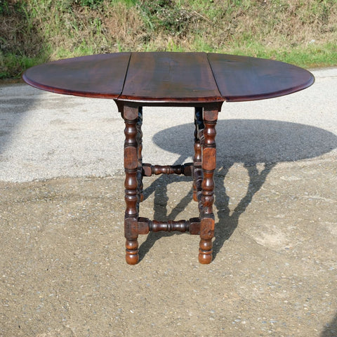 Antique oval drop leaf dining table, walnut