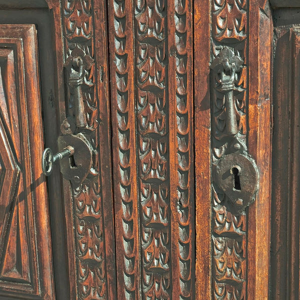 Antique heavily carved one-drawer, two-door sacristy chest, walnut, elm, oak, holm oak