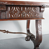 Antique carved three-drawer library table, walnut