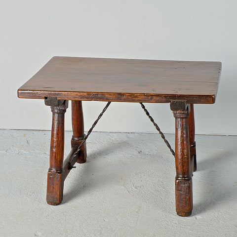Antique mast leg accent table with iron stretchers, walnut