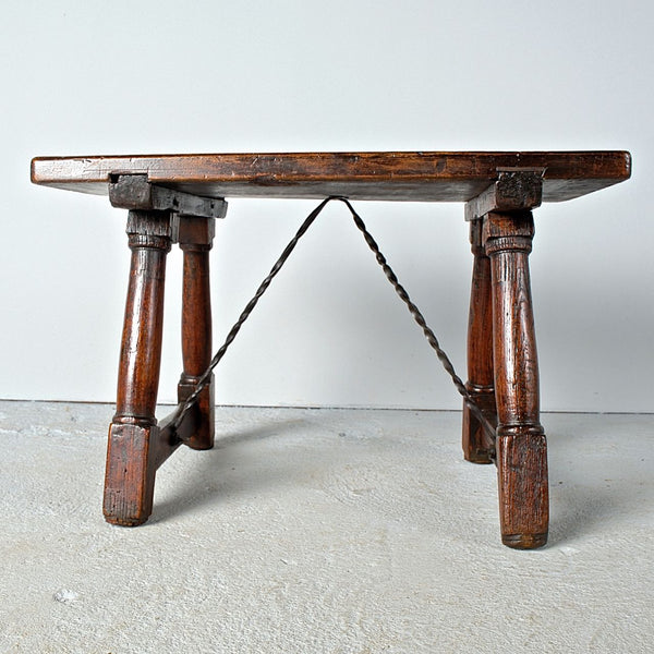 Antique mast leg accent table with iron stretchers, walnut