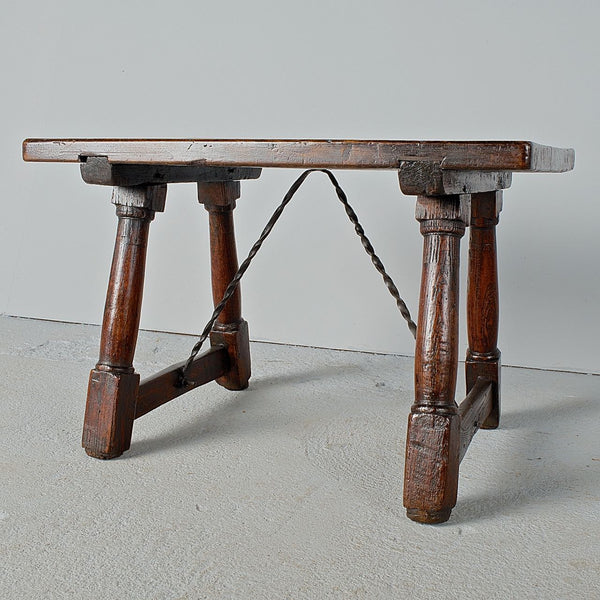 Antique mast leg accent table with iron stretchers, walnut