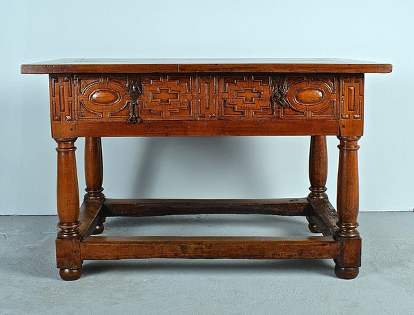Antique two-drawer mast leg library table with “chain carving”, walnut