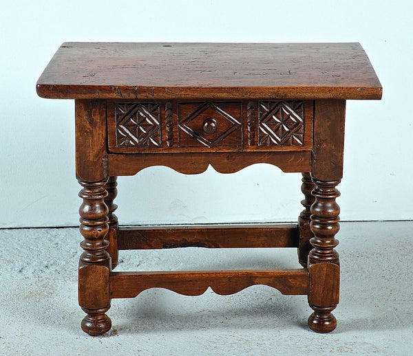 Antique low turned leg table with carved drawer, walnut