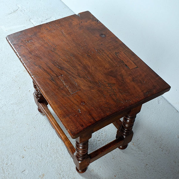 Antique low turned leg table with carved drawer, walnut