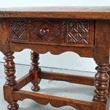 Antique low turned leg table with carved drawer, walnut