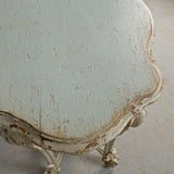 Antique carved and painted oval “tortoise” table, pine