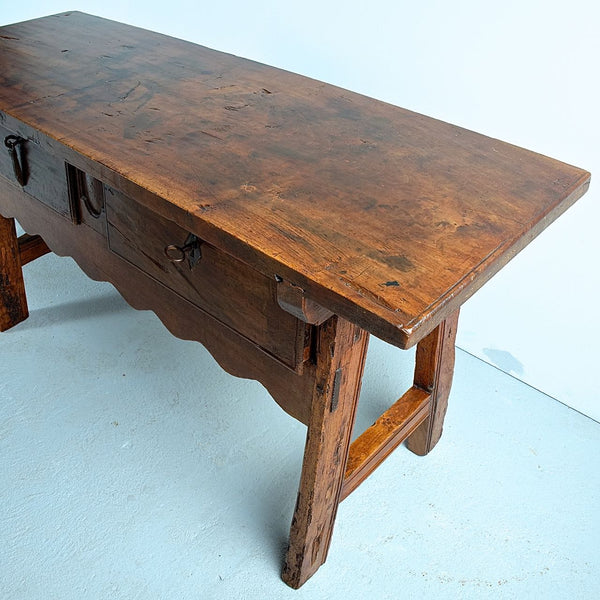 Antique two-drawer mixed wood Castilian trestle leg table