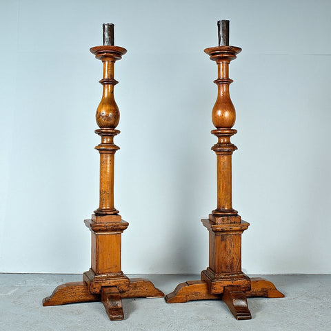 Antique pair of large turned floor candlesticks, pine