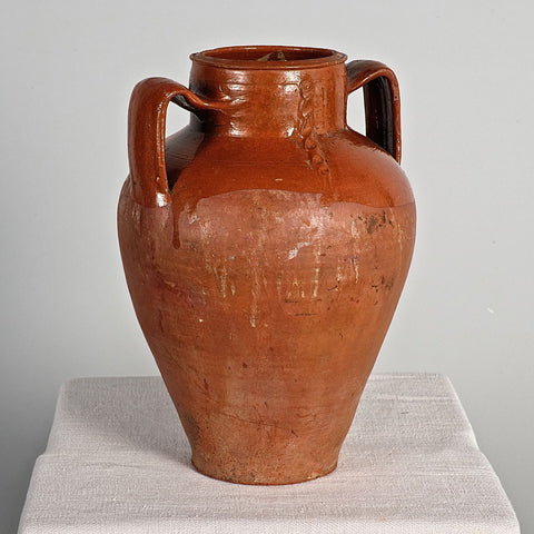 Large antique two-handle braided semi-glazed red clay jar