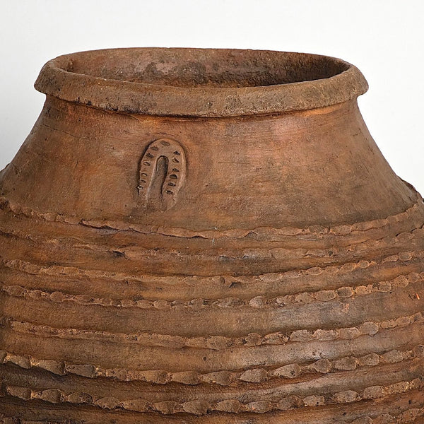 Antique crimped ribbed terracotta olive oil jar with horse shoe