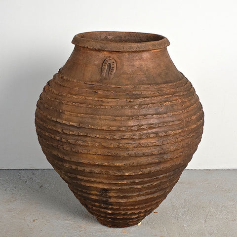 Antique crimped ribbed terracotta olive oil jar with horse shoe