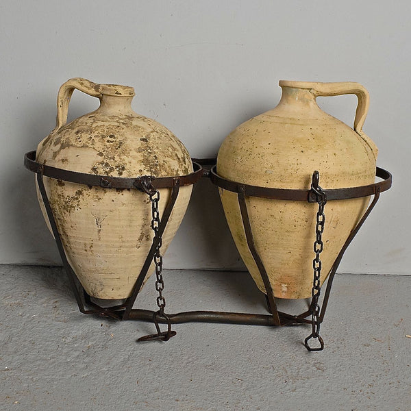 Antique two jug wrought iron carrier