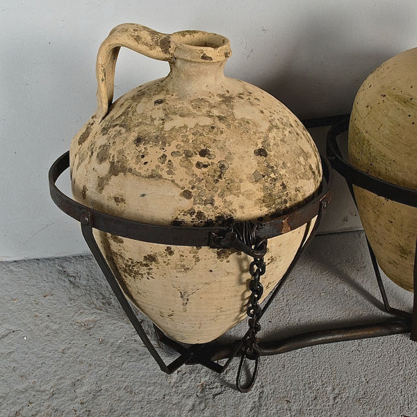 Antique two jug wrought iron carrier