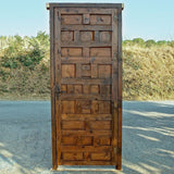 Antique framed single panel pine door with carved raised panels