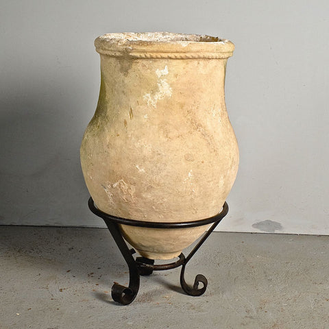 Antique large roll neck terracotta olive oil jar on iron stand