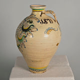 Large antique painted and glazed single handle water jug, “Blue and green flower with pomegranate on shield”