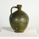 Antique round glazed dark green water jug