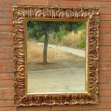 Antique carved and gilt mirror