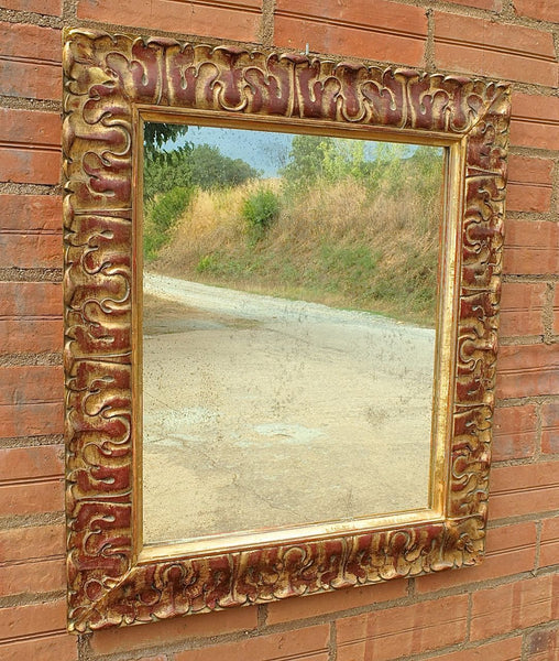 Antique carved and gilt mirror