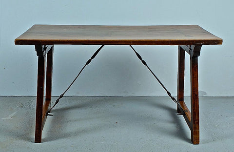 Antique trestle leg table with iron stretchers, walnut
