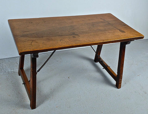 Antique trestle leg table with iron stretchers, walnut