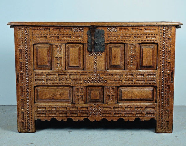 Antique carved and paneled Basque arms chest, oak