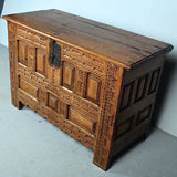 Antique carved and paneled Basque arms chest, oak