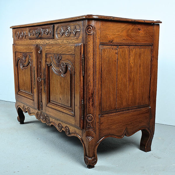 Antique carved two-door, single-drawer credenza, oak