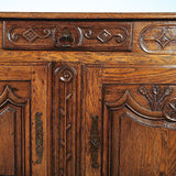 Antique carved two-door, single-drawer credenza, oak