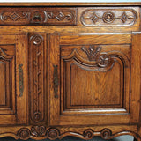 Antique carved two-door, single-drawer credenza, oak