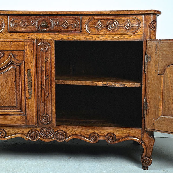 Antique carved two-door, single-drawer credenza, oak