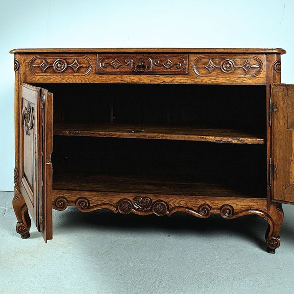 Antique carved two-door, single-drawer credenza, oak