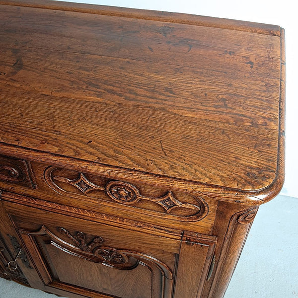 Antique carved two-door, single-drawer credenza, oak