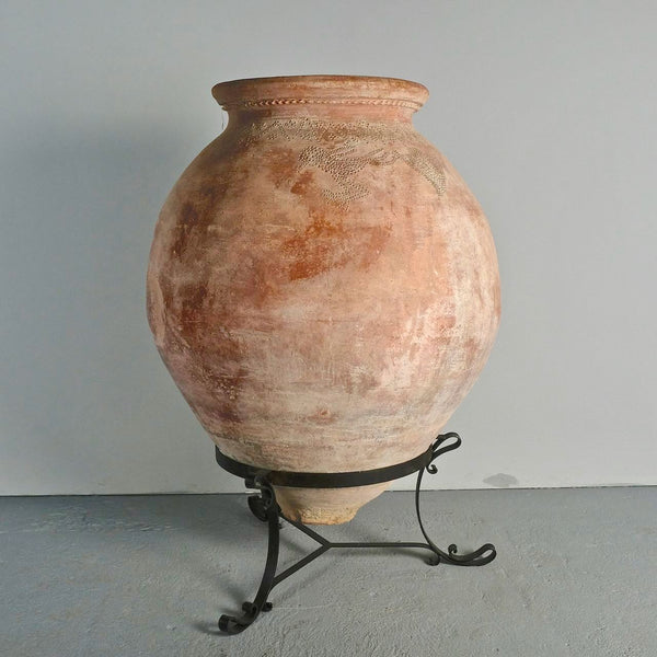 Antique large “Arabesque” oil jar on iron stand