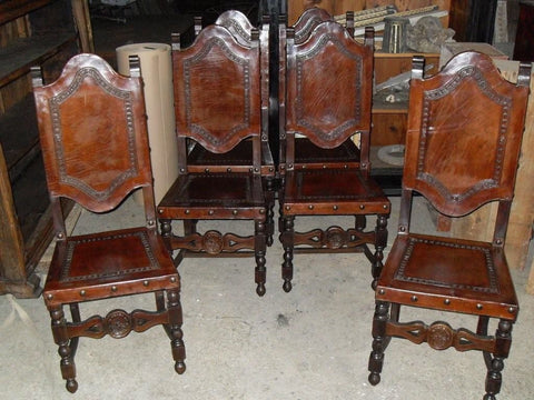 Antique set of six tooled leather dining chairs without arms