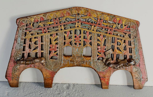 Antique polychromed oxen yoke with carved fans and florals, holm oak