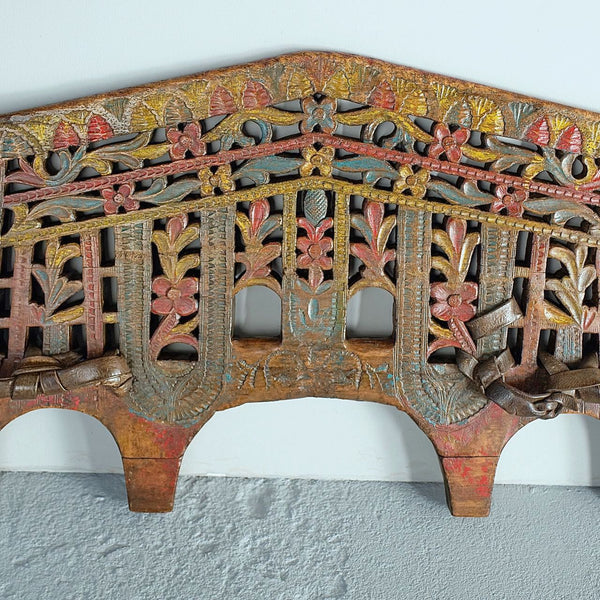 Antique polychromed oxen yoke with carved fans and florals, holm oak