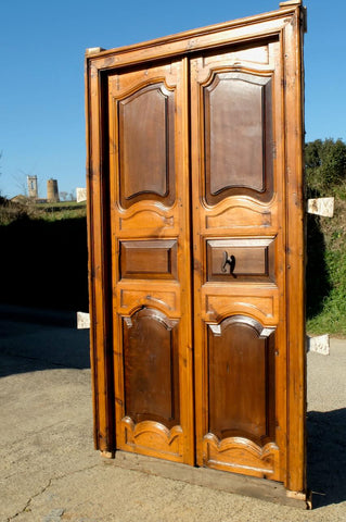 Antique framed two-panel library door, pine with walnut panels