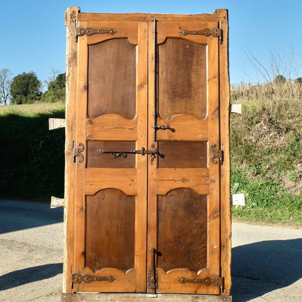Antique framed two-panel library door, pine with walnut panels