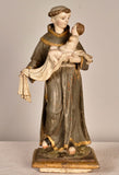 Antique carved and painted wood sculpture of Saint Anthony with child
