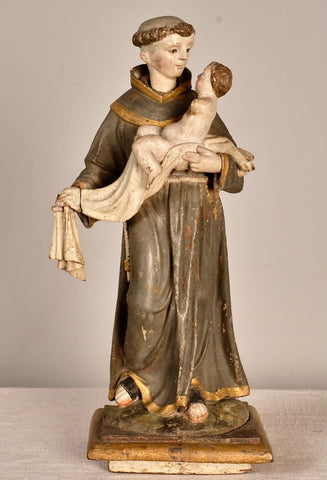 Antique carved and painted wood sculpture of Saint Anthony with child